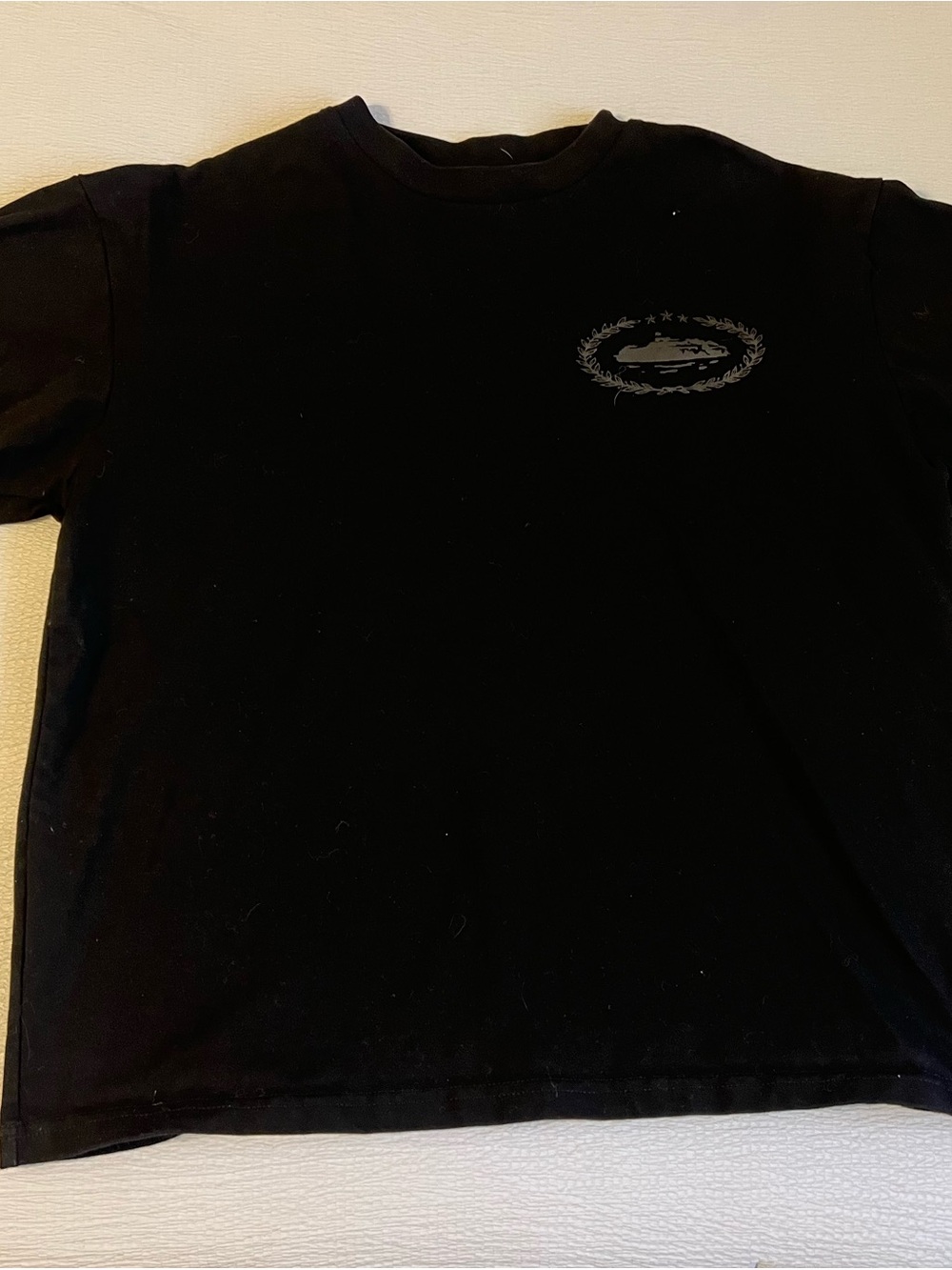 Men's Short-Sleeve Black Crew Neck Tee with Subtle Chest Crest